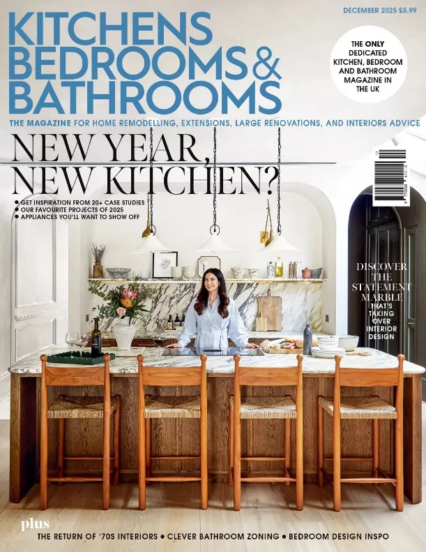 A woman standing in front of a kitchen counter.