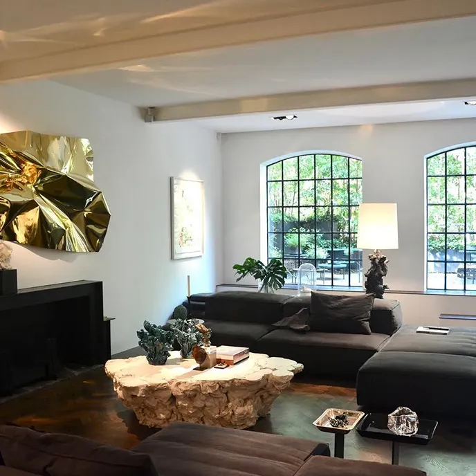 a living room filled with furniture and a fire place