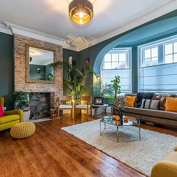 a living room filled with furniture and a fire place